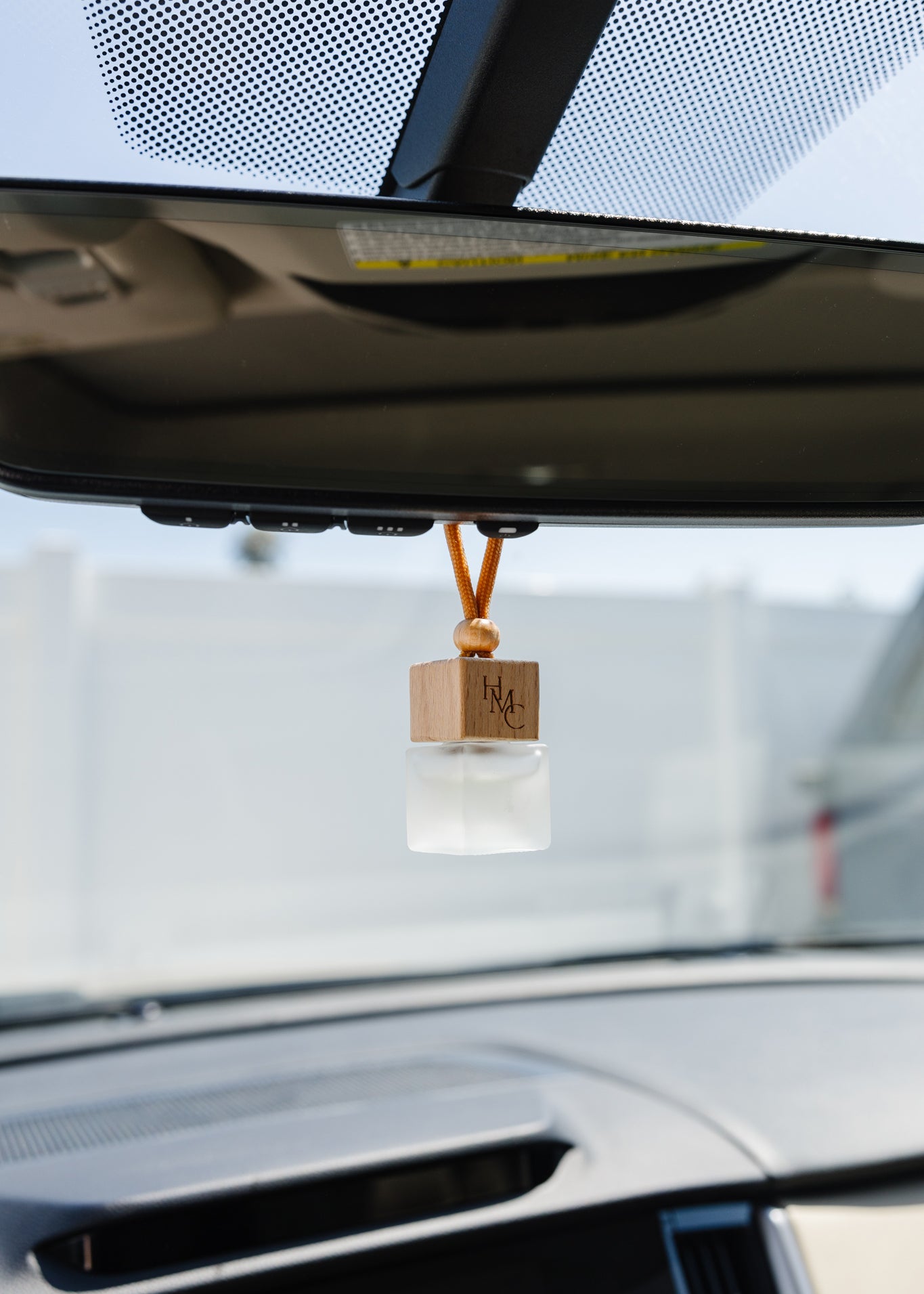 Hanging car air freshener diffuser with frosted glass jar and bottle of essential oils | by Hot Mess Creations in Ventura, CA