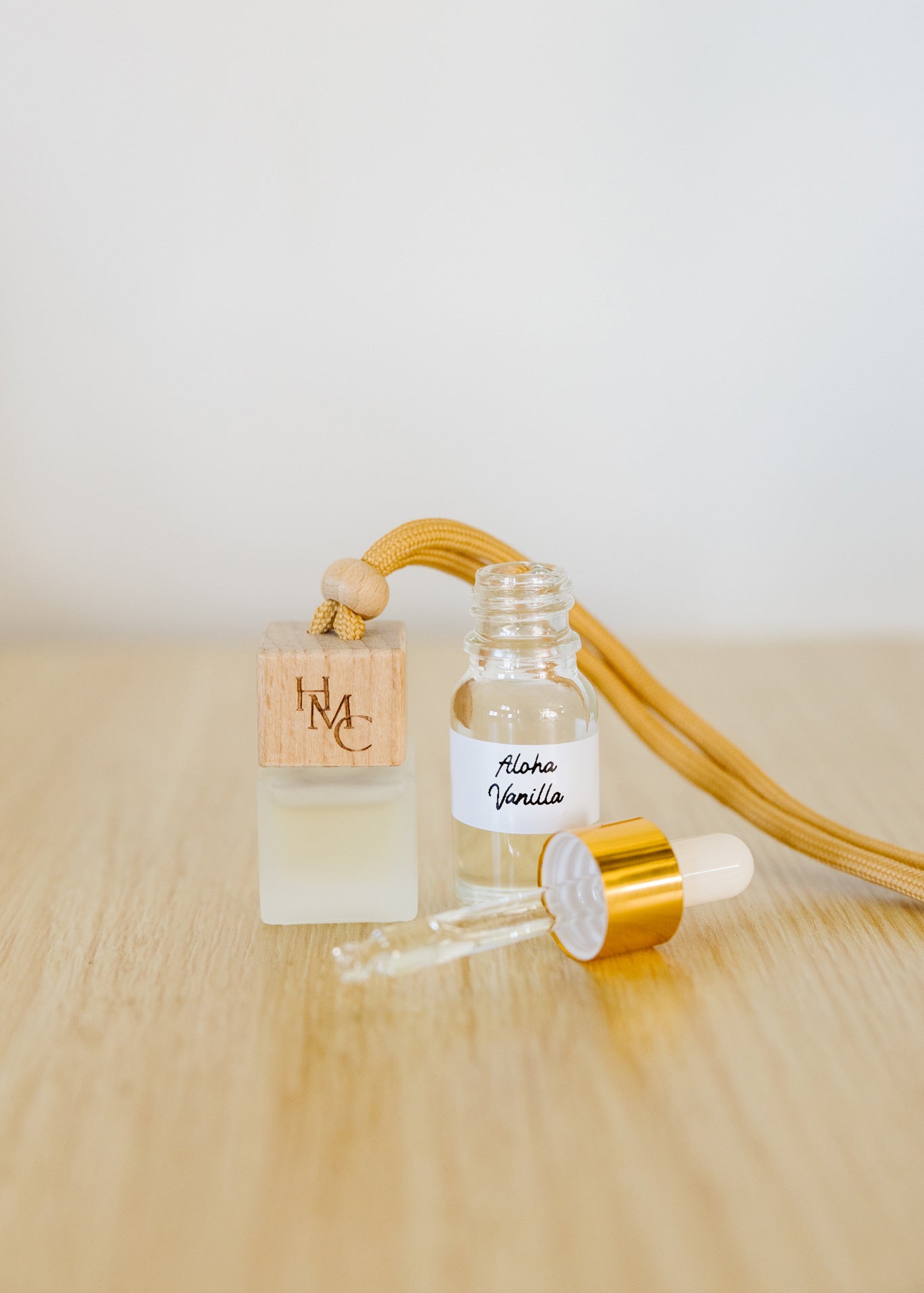 Hanging car air freshener diffuser with frosted glass jar and bottle of essential oils | by Hot Mess Creations in Ventura, CA