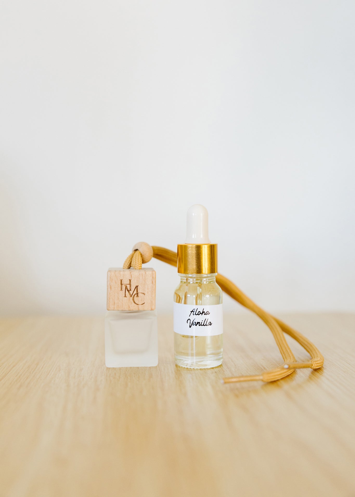 Hanging car air freshener diffuser with frosted glass jar and bottle of essential oils | by Hot Mess Creations in Ventura, CA