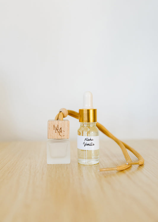 Hanging car air freshener diffuser with frosted glass jar and bottle of essential oils | by Hot Mess Creations in Ventura, CA