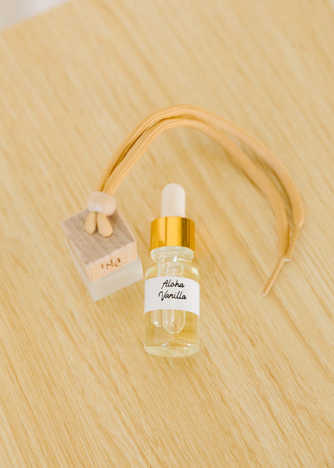 Hanging car air freshener diffuser with frosted glass jar and bottle of essential oils | by Hot Mess Creations in Ventura, CA