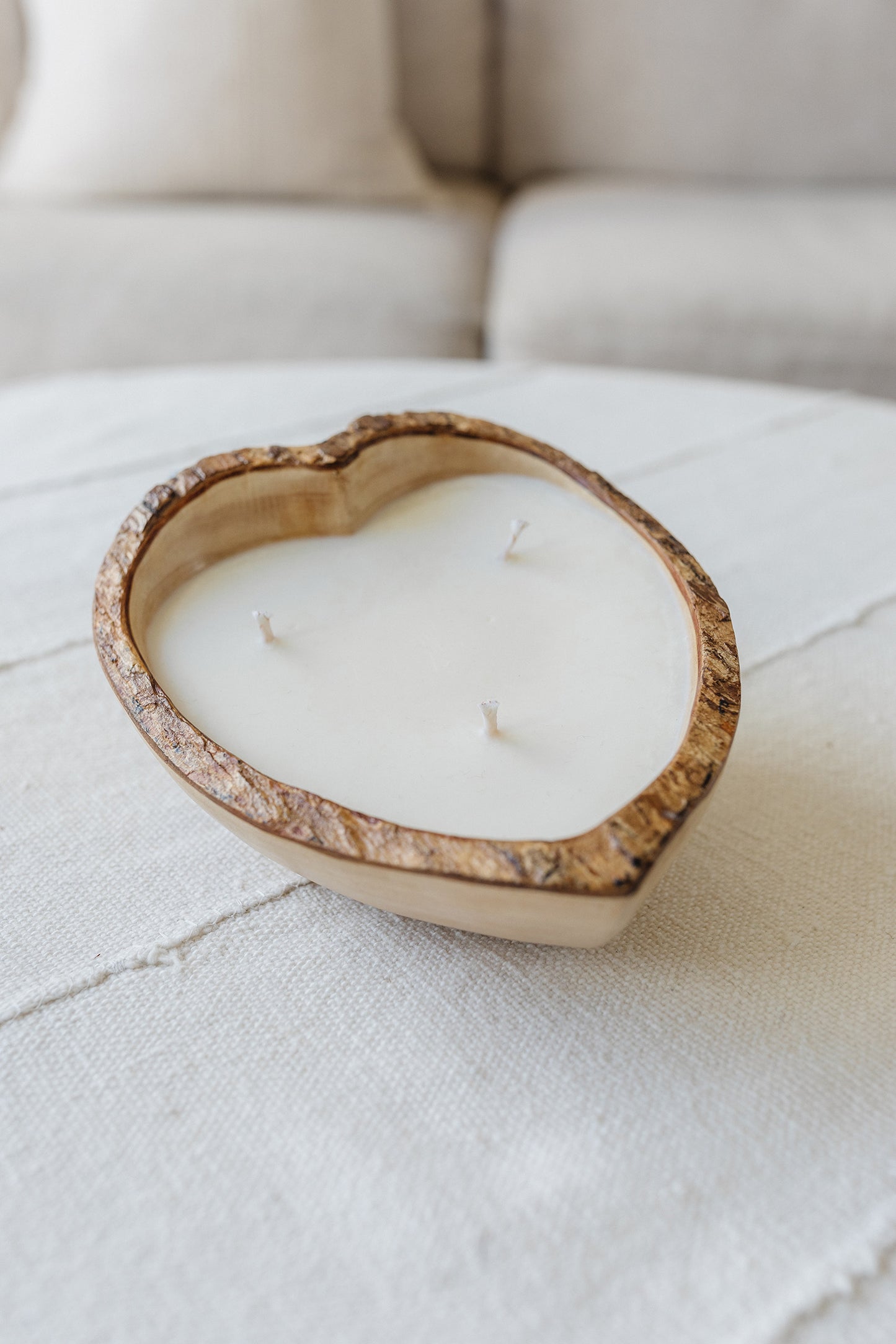 Natural wooden heart shaped candle